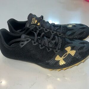 Under Armour HOVR Smoke Rider Track & Field Shoes Size M 9.5/W 11 black Gold